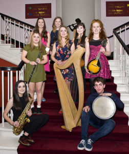 Siansa Group playing instruments on staircase